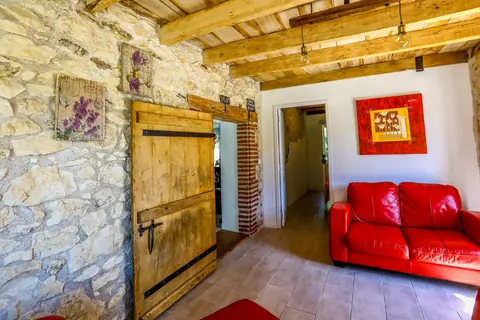 Annex entrance with barn door and stone walls