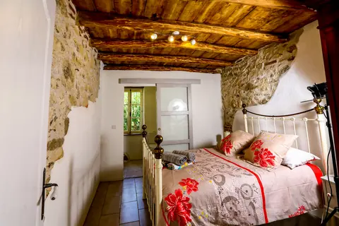 Annex bedroom with exposed beam ceiling