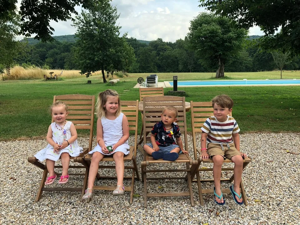 Children enjoying the gardens and pool at Lasclottes