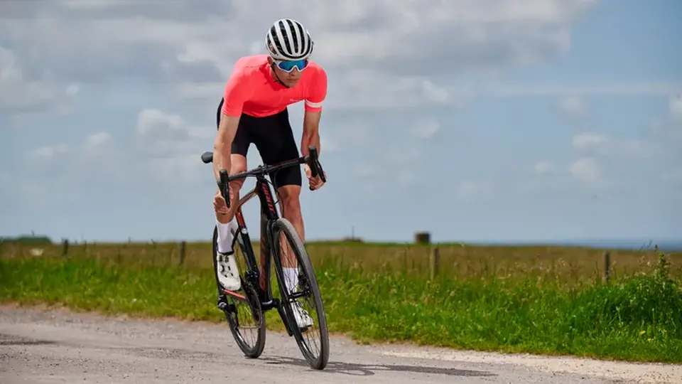 Solo cyclist on a quiet road in Lot-et-Garonne